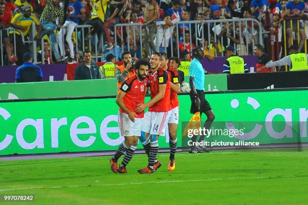 Egypt national soccer team forward Mohamed Salah , midfielder Ramadan Sobhi and defender Ramy Rabia, celebrate Egypt's 1st goal during the 2018 World...