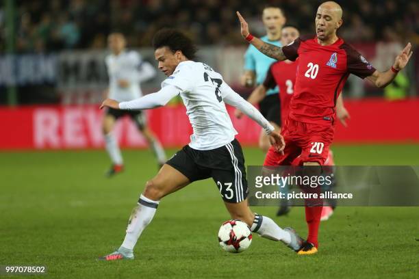 Germany's Leroy Sane and Azerbaijan's Richard Almeida vying for the ball during the World Cup Group C soccer qualifier match between Germany and...