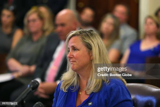 Kathy Malone, the sister of deceased Boston Firefighter Ed Walsh, pauses to regain her thoughts while speaking before a special commission at the...