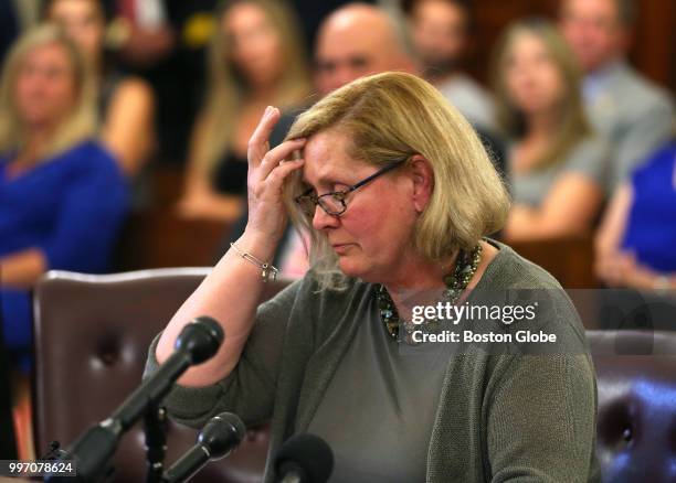 Kathy Crosby-Bell, the mother of deceased Boston Firefighter Michael Kennedy, pauses during an emotional testimony before a special commission at the...