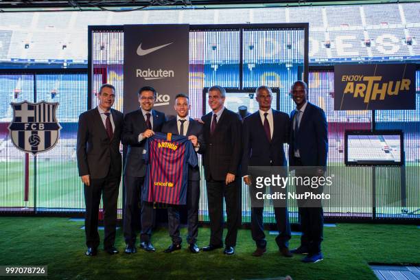 Josep Maria Bartomeu president of FC Barcelona, Eric Abidal and Jordi Mestre at the presentation of Arthur Melo from Brasil after being the first new...
