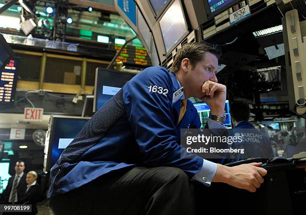 Trader works on the floor of the New York Stock Exchange in New York, U.S., on Monday, May 17, 2010. U.S. Stocks slid, led by energy shares, as the...