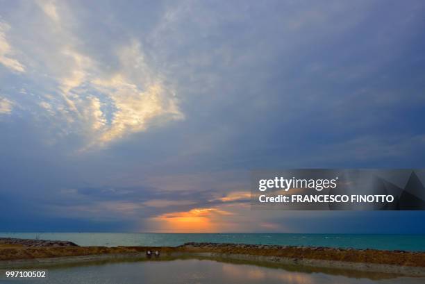 the sea at dawn in bibione - bibione stock pictures, royalty-free photos & images