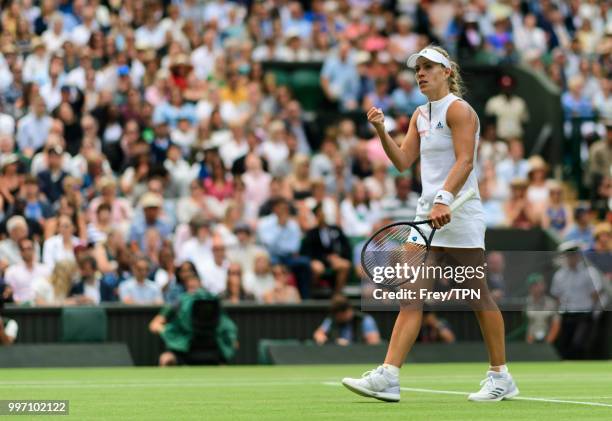 Angelique Kerber of Germany celebrates against Daria Kasatkina of Russia in the ladies' quarter final at the All England Lawn Tennis and Croquet Club...