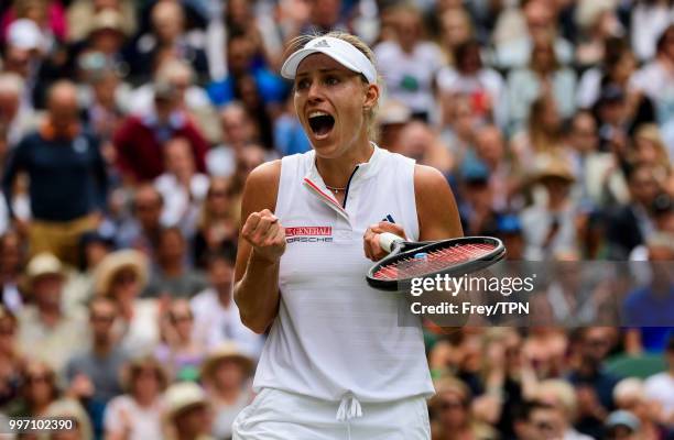 Angelique Kerber of Germany celebrates after beating Daria Kasatkina of Russia in the ladies' quarter final at the All England Lawn Tennis and...
