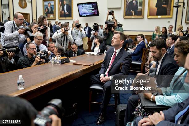 Peter Strzok, an agent at the Federal Bureau of Investigation , center, waits to begin a joint House Judiciary, Oversight and Government Reform...