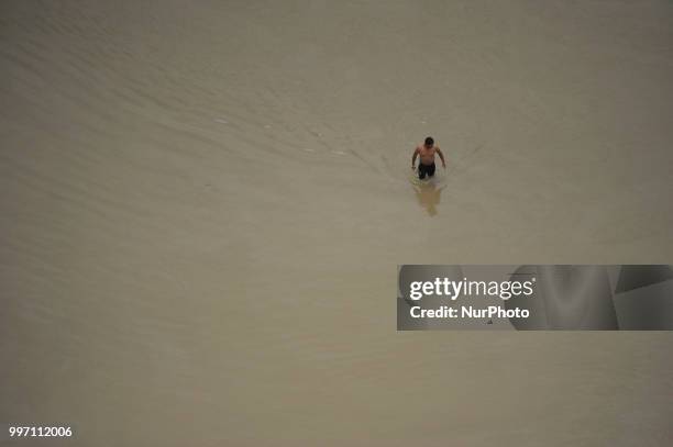 Nepalese man searching their belongings on a flood water overflowed from River affected due to incessant rainfall at Thimi, Bhaktapur, Nepal on...