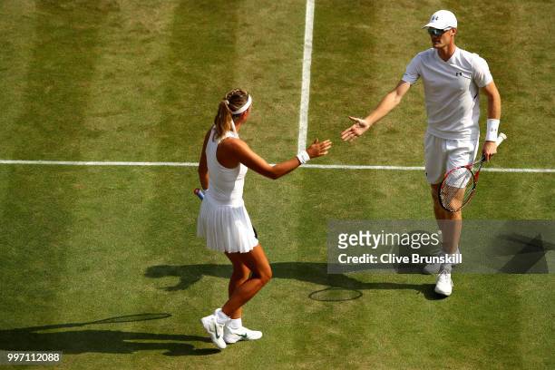 Jamie Murray of Great Britain and Victoria Azarenka of Belarus celebrate a point against Jean-Julien Rojer and Demi Schuurs of The Netherlands on day...