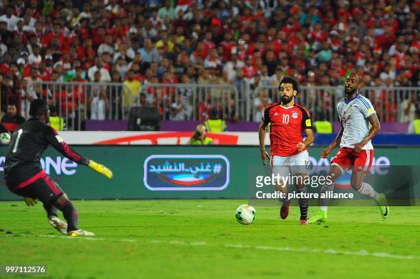 Dpatop - Egypt's forward Mohamed Salah scores his side's second goal during the FIFA 2018 World Cup qualifying match between the Democratic Republic...