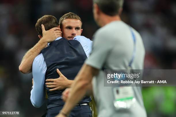 Gareth Southgate head coach / manager of England consoles Jordan Henderson of England at full time during the 2018 FIFA World Cup Russia Semi Final...