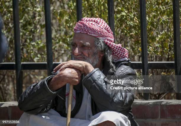 An elder member of the Yemenite Jewish community queues for food from the organisation "Mona Relief Yemen" in a guarded camp in Sanaa, Yemen, 08...