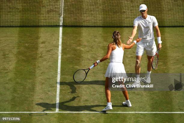 Jamie Murray of Great Britain and Victoria Azarenka of Belarus celebrate a point against Jean-Julien Rojer and Demi Schuurs of The Netherlands on day...