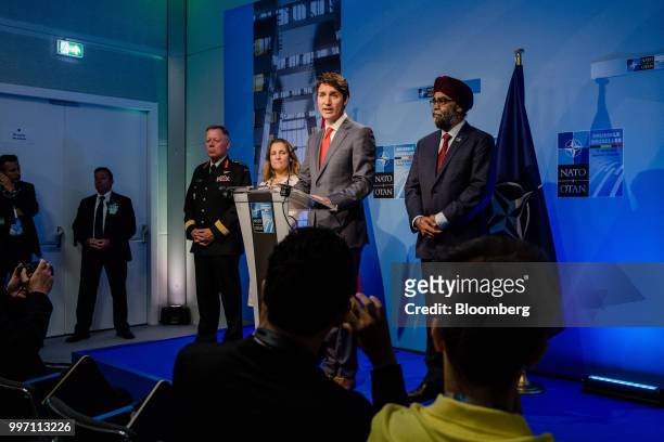 Justin Trudeau, Canada's prime minister, center, speaks during a news conference with General Jonathan Vance, Canada's chief of defense, left,...