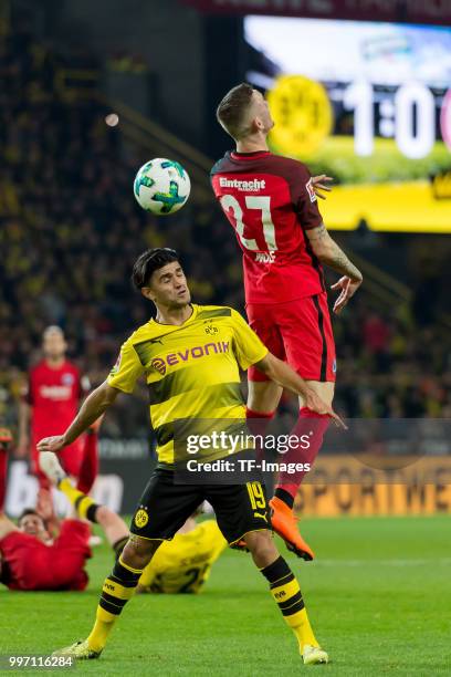 Mahmound Dahoud of Dortmund and Marius Wolf of Frankfurt battle for the ball during the Bundesliga match between Borussia Dortmund and Eintracht...