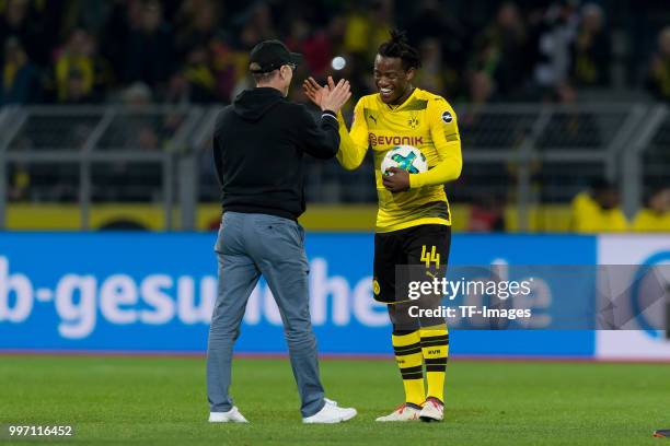 Head coach Peter Stoeger of Dortmund and Michy Batshuayi of Dortmund celebrate after winning the Bundesliga match between Borussia Dortmund and...