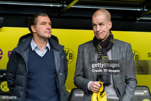 Sporting director Michael Zorc of Dortmund and Director of Marketing and Sales Carsten Cramer of Dortmund look on prior to the Bundesliga match...