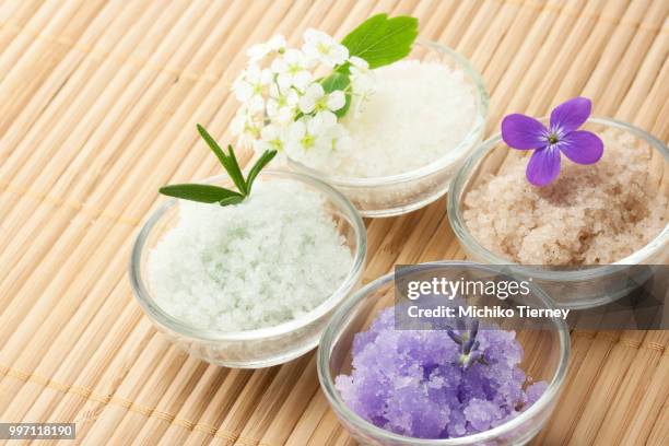 bath salt with flowers - bath salt stock-fotos und bilder