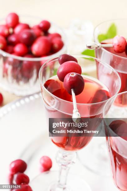 cranberry juice with fresh cranberries - cranberry juice stock pictures, royalty-free photos & images