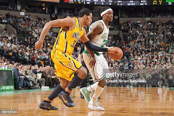 Marquis Daniels of the Boston Celtics drives the ball against Danny Granger of the Indiana Pacers on March 12, 2010 at the TD Garden in Boston,...