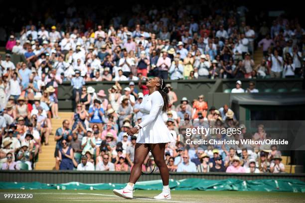 Womens Singles, Semi-Final - Julia Goerges v Serena Williams - Serena Williams looks up and smiles as she celebrates winning the match at All England...