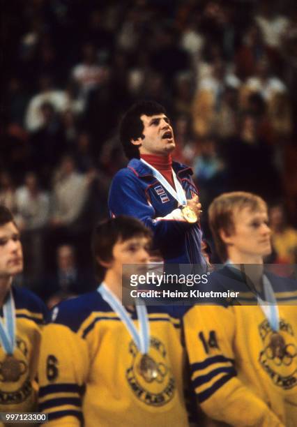 Winter Olympics: USA Mike Eruzione on stand wearing gold medal singing anthem at James B. Sheffield Speed Skating Oval. Lake Placid, NY 2/24/1980...