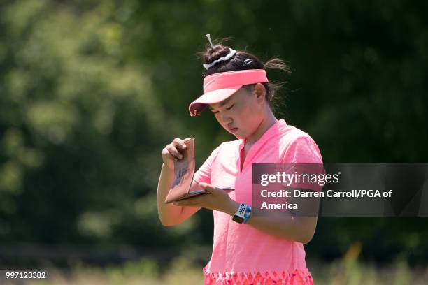 Lucy reads her yardage book on the third hole during Round Two of the Girls Junior PGA Championship held at Kearney Hill Golf Links on July 10, 2018...