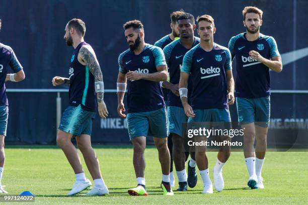 Douglas Pereira from Brasil, Denis Surez from Spain, Sergi Samper from Spain and Marlon Santos from Brasil during the first FC Barcelona training...