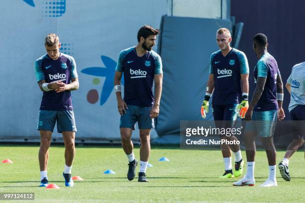 Andre Gomes from Portugal, Lucas Digne from France and Jasper Cillessen from Holland during the first FC Barcelona training session of the 2018/2019...
