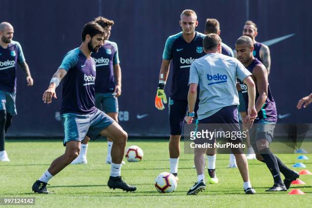 Andre Gomes from Portugal, Jasper Cillessen from Holland and Rafinha Alcantara from Brasil during the first FC Barcelona training session of the...