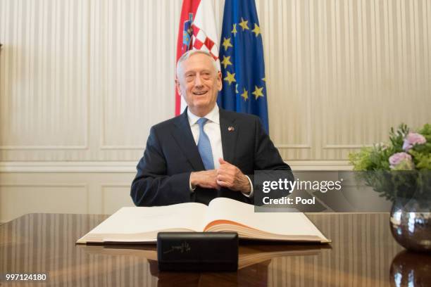 Secretary of Defense James Mattis signs a guest book before a meeting with Croatian Prime Minister Andrej Plenkovic on July 12, 2018 in Zagreb,...