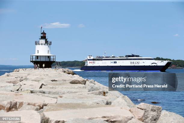 The CAT ferry passes Spring Point Ledge Light while departing Portland Harbor on Wednesday toward Yarmouth, N.S. A proposal to restart the CAT ferry...