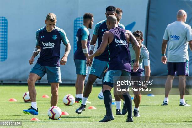 Lucas Digne from France and Rafinha Alcantara from Brasil during the first FC Barcelona training session of the 2018/2019 La Liga pre season in...