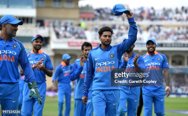 Kuldeep Yadav of India salutes the crowd as he leaves the field after picking up six wickets during the Royal London One-Day match between England...