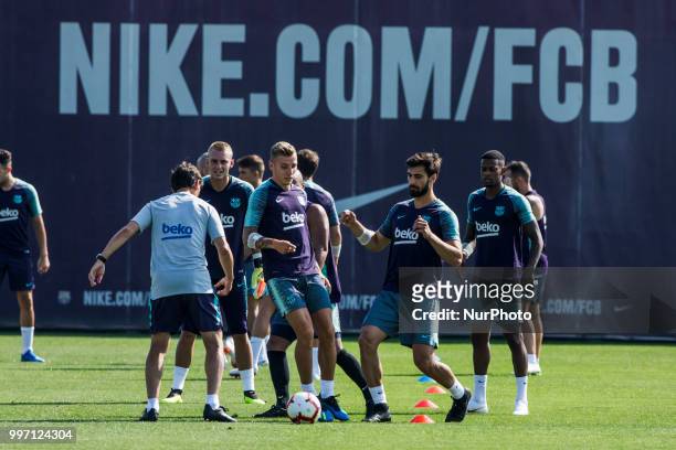 Andre Gomes from Portugal and Lucas Digne from France during the first FC Barcelona training session of the 2018/2019 La Liga pre season in Ciutat...
