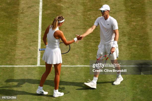 Jamie Murray of Great Britain and Victoria Azarenka of Belarus celebrate a point against Jean-Julien Rojer and Demi Schuurs of The Netherlands on day...