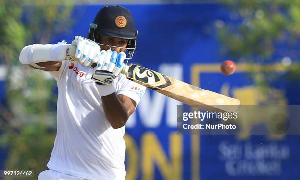 Sri Lankan cricketer Dimuth Karunaratne plays a shot during the 1st Day of of the 1st Test cricket match between Sri Lanka and South Africa at Galle...