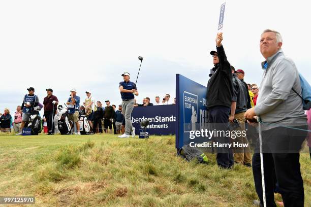 Ian Poulter of England takes his tee shot on hole thirteen during day one of the Aberdeen Standard Investments Scottish Open at Gullane Golf Course...