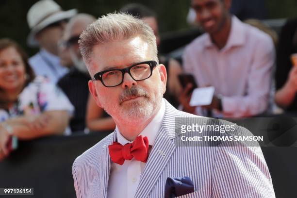 Screenwriter, director and producer Christopher McQuarrie poses on the red carpet as he arrives to attend the world premiere of his new film Mission:...