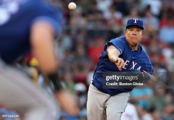 Texas Rangers starting pitcher Bartolo Colon fires a first inning pick off attempt to first base. The Boston Red Sox host the Texas Rangers in a...