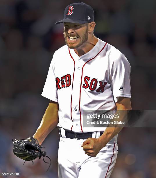 Boston Red Sox pitcher Chris Sale reacts after he started a top of the sixth inning-ending double play. The Boston Red Sox host the Texas Rangers in...