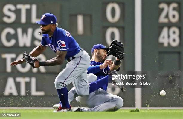 Texas Rangers left fielder Joey Gallo, right, and center fielder Delino DeShields fail to catch a two-run triple hit by Red Sox player Xander...