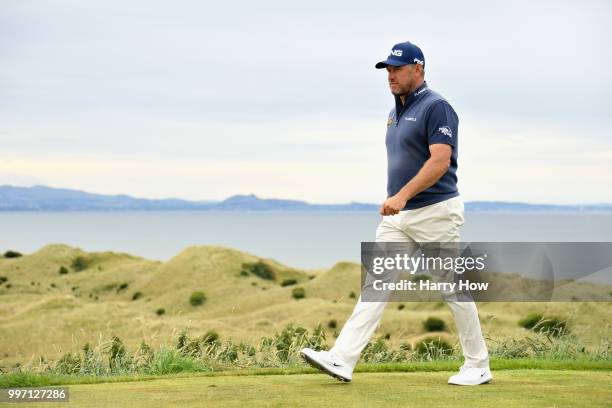 Lee Westwood of England leaves the tee on hole fifteen during day one of the Aberdeen Standard Investments Scottish Open at Gullane Golf Course on...