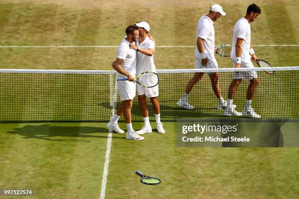 Mike Bryan and Jack Sock of The United States celebrate match point against Dominic Inglot of Great Britain and Franko Skugor of Croatia during their...