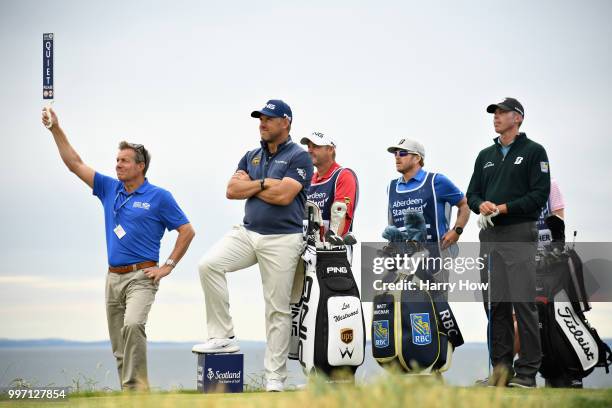 Lee Westwood of England and Matt Kuchar of USA look on, on hole fifteen during day one of the Aberdeen Standard Investments Scottish Open at Gullane...