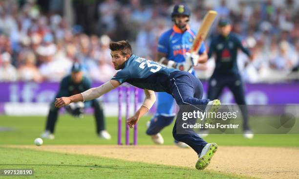 England bowler Mark Wood just fails to hold onto a sharp return catch off India batsman Shikhar Dhawan during the 1st Royal London One Day...