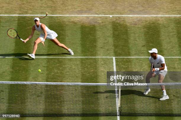 Jay Clarke and Harriet Dart of Great Britain return against Juan Sebastian Cabal of Colombia and Abigail Spears of the United States during their...