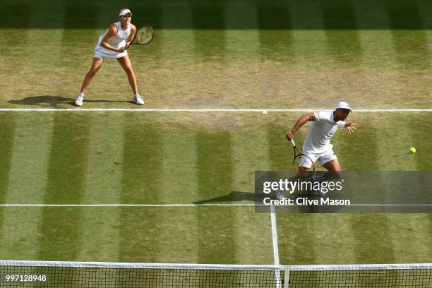 Jay Clarke and Harriet Dart of Great Britain return against Juan Sebastian Cabal of Colombia and Abigail Spears of the United States during their...