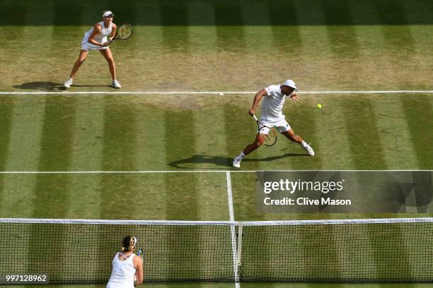 Jay Clarke and Harriet Dart of Great Britain return against Juan Sebastian Cabal of Colombia and Abigail Spears of the United States during their...