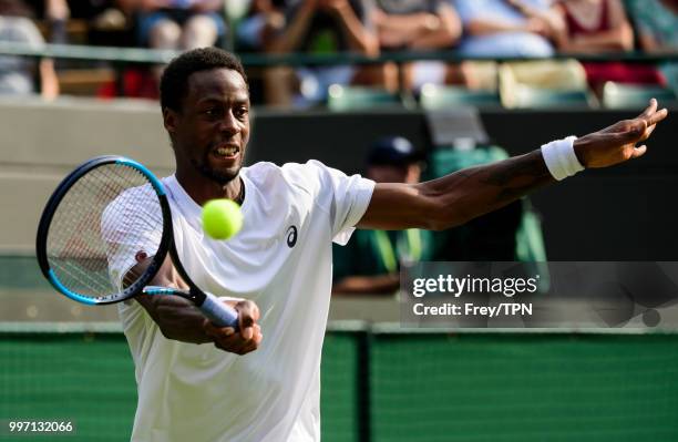 Gael Monfils of France in action against Kevin Anderson of South Africa in the fourth round of the gentlemen's singles at the All England Lawn Tennis...