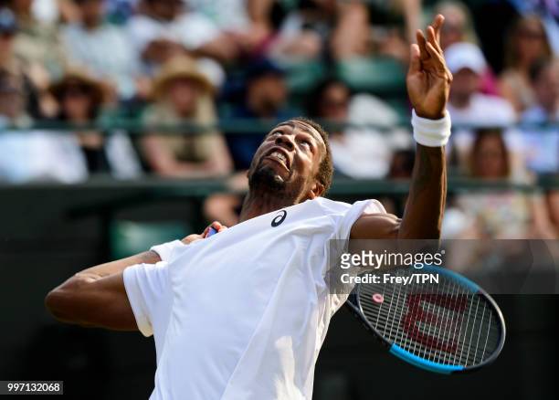 Gael Monfils of France in action against Kevin Anderson of South Africa in the fourth round of the gentlemen's singles at the All England Lawn Tennis...